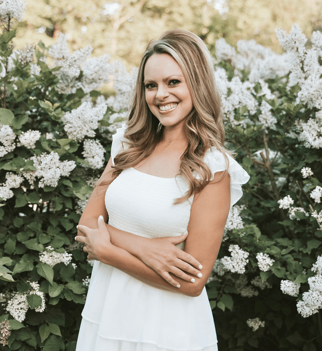 Amanda Elizabeth Martin standing among flowering trees