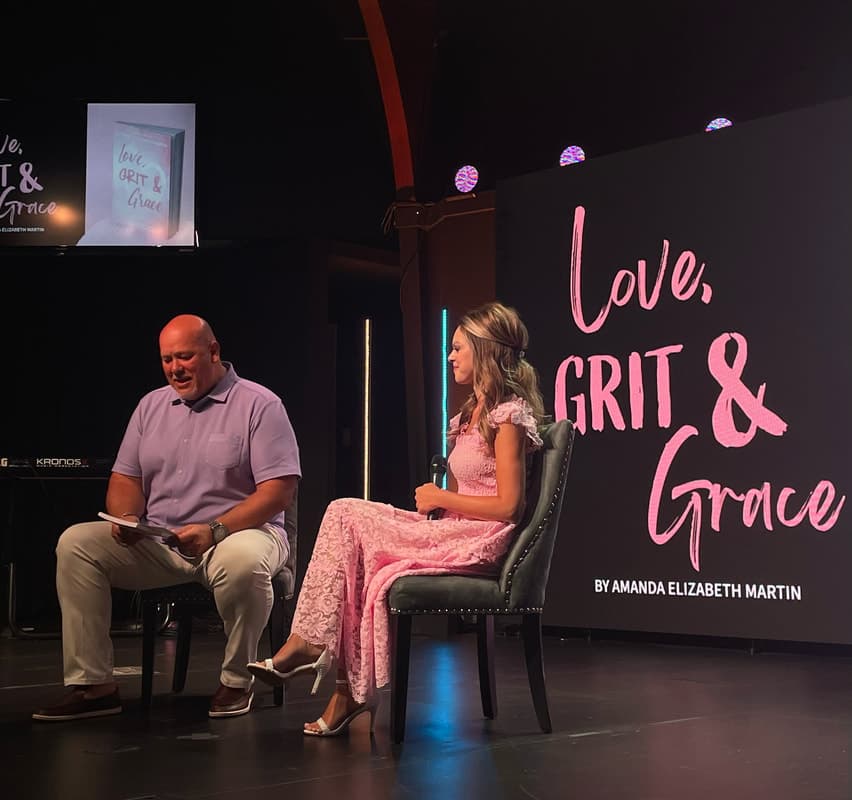 Amanda discussing Love, Grit & Grace on stage